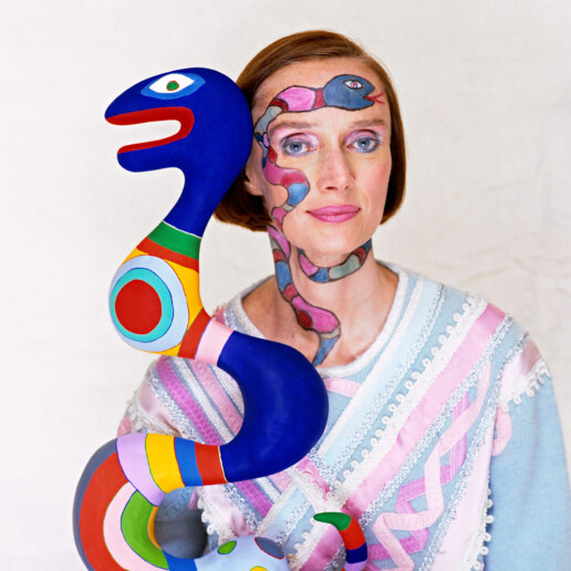 French-American sculptor, painter, and filmmaker Niki de Saint Phalle with one of her pieces, 1983.